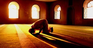 Muslim man prays in mosque